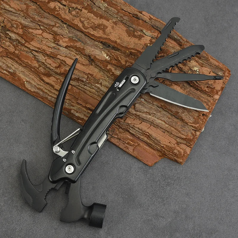 Black multitool with hammer, pliers, and knives on wood, ideal for outdoor survival gear
