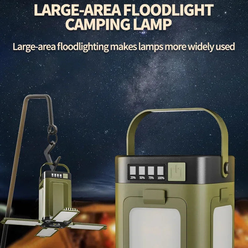 Portable large-area floodlight camping lamp with handle, shown illuminated outdoors at night